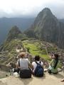 [Photo of tourists at Machu Picchu]