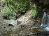 [Photo of an old sawmill's raceway arch beside Hilton Falls]